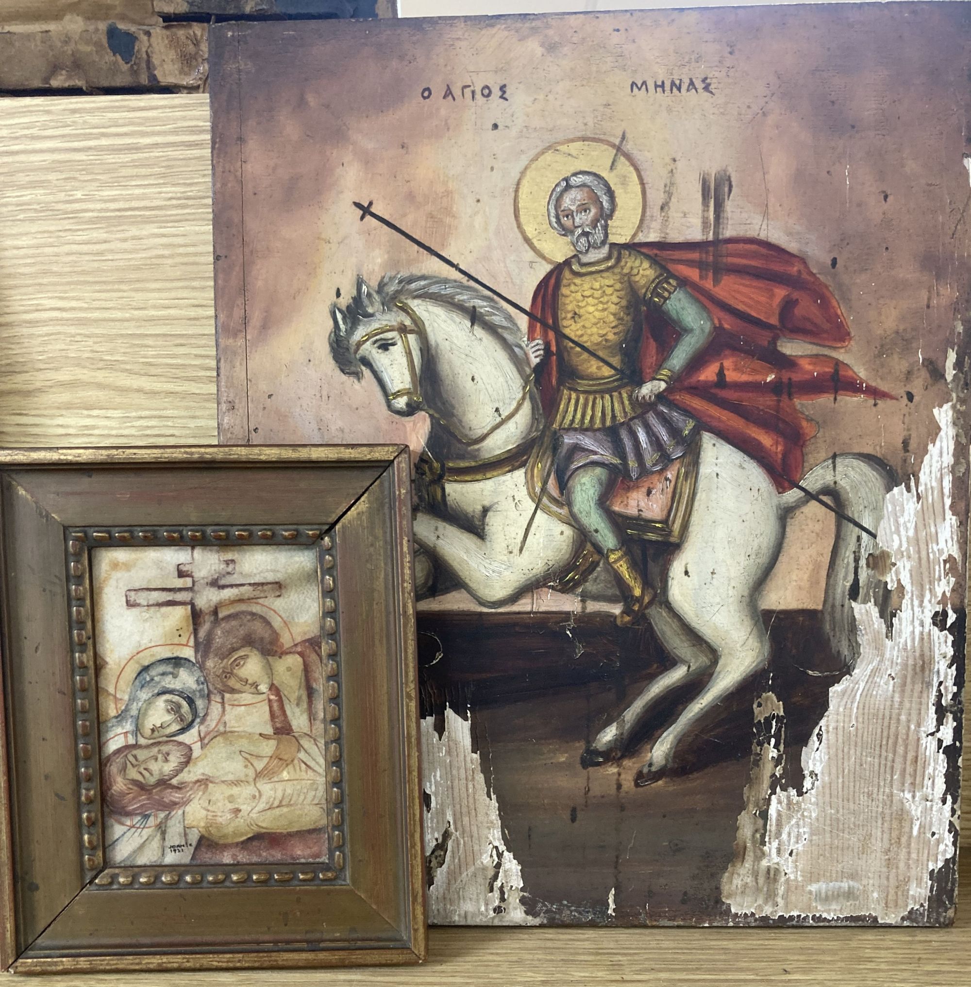 Eastern European School, tempera on panel, Icon of St Minas on horseback, 36 x 29.5cm and a small work on parchment, signed Joan